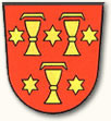 Das Wappen von Staufen zeigt 3 goldene Kelche und 5 Sterne auf rotem Grund